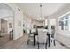 Charming dining area with neutral decor, bright natural light, and tile flooring flows into the kitchen at 24783 E Arkansas Pl, Aurora, CO 80018