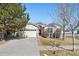 Charming ranch-style home with a two-car garage and a well-manicured front yard at 24783 E Arkansas Pl, Aurora, CO 80018