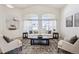 Spacious living room with a neutral color palette, a plush rug, and plenty of natural light at 24783 E Arkansas Pl, Aurora, CO 80018