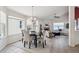The dining area leads into the living room with fireplace and lots of natural light at 24783 E Arkansas Pl, Aurora, CO 80018