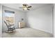 Serene bedroom with a chair, natural light and classic decor, creating a cozy and inviting space at 892 Macaw St, Brighton, CO 80601