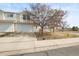 Inviting two-story home with a two-car garage and mature landscaping, perfect for suburban living at 892 Macaw St, Brighton, CO 80601