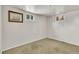 Unfinished basement with neutral carpeting and windows allowing natural light at 1225 S Honey Way, Denver, CO 80224