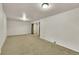 Expansive finished basement with neutral carpeting and recessed lighting at 1225 S Honey Way, Denver, CO 80224