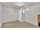 Cozy bedroom with neutral carpet, light walls, and natural light from two windows at 1225 S Honey Way, Denver, CO 80224