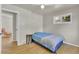 Bedroom with hardwood floors, ceiling fan, and a door leading to other rooms at 1225 S Honey Way, Denver, CO 80224