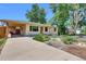 Charming single-story home with a covered parking and well-kept landscaping at 1225 S Honey Way, Denver, CO 80224