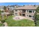 Aerial view of house showcasing backyard patio and landscaping at 9005 Stonecrest Way, Highlands Ranch, CO 80129