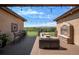 Relaxing backyard deck featuring a fireplace and golf course views at 9005 Stonecrest Way, Highlands Ranch, CO 80129