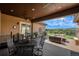 Spacious backyard deck with seating area and mountain views at 9005 Stonecrest Way, Highlands Ranch, CO 80129