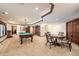 Finished basement featuring game table, pool table, and seating area at 9005 Stonecrest Way, Highlands Ranch, CO 80129