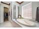 Relaxing bathroom with soaking tub and glass block window at 9005 Stonecrest Way, Highlands Ranch, CO 80129