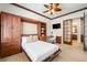 Comfortable bedroom with a built-in murphy bed and desk at 9005 Stonecrest Way, Highlands Ranch, CO 80129