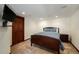 Basement bedroom with a double bed and a dark-wood frame at 9005 Stonecrest Way, Highlands Ranch, CO 80129