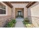 Inviting entryway with stonework and a charming front door at 9005 Stonecrest Way, Highlands Ranch, CO 80129