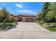 Ranch home with 3 car garage and stone accents at 9005 Stonecrest Way, Highlands Ranch, CO 80129