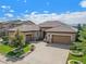 Luxury ranch home with 3-car garage and landscaped yard at 9005 Stonecrest Way, Highlands Ranch, CO 80129