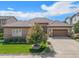 Beautiful ranch home with a landscaped yard and attached garage at 9005 Stonecrest Way, Highlands Ranch, CO 80129