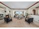 Spacious living room with fireplace and large windows at 9005 Stonecrest Way, Highlands Ranch, CO 80129