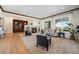 Bright living room with hardwood floors and fireplace at 9005 Stonecrest Way, Highlands Ranch, CO 80129