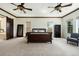 Main bedroom with ensuite bathroom access and sitting area at 9005 Stonecrest Way, Highlands Ranch, CO 80129