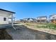 Wide open backyard with views of other homes in the neighborhood at 9175 Uravan Ct, Commerce City, CO 80022