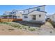 View of the backyard with a covered patio and wooden fence for privacy at 9175 Uravan Ct, Commerce City, CO 80022