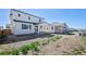 A spacious backyard with a view of the home's covered patio at 9175 Uravan Ct, Commerce City, CO 80022