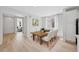 Elegant dining area with a wooden table and upholstered chairs at 9175 Uravan Ct, Commerce City, CO 80022