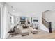 Cozy living room features a fireplace, comfortable seating, and stylish decor at 9175 Uravan Ct, Commerce City, CO 80022