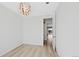 The home office features an overhead decorative light and wood floors at 9175 Uravan Ct, Commerce City, CO 80022