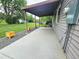 Back patio offering serene outdoor living with a covered patio and fresh landscaping at 1405 S Utica St, Denver, CO 80219