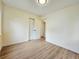 Inviting bedroom featuring hardwood floors, neutral walls, and closet space at 1405 S Utica St, Denver, CO 80219