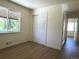 Bright bedroom with new floors and a large window at 1405 S Utica St, Denver, CO 80219