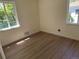 Sunlit bedroom with new flooring and neutral paint at 1405 S Utica St, Denver, CO 80219