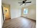 Bright bedroom with hardwood floors, closet, a ceiling fan, and natural light from the window at 1405 S Utica St, Denver, CO 80219