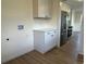 The eat-in kitchen features stainless steel appliances and crisp white cabinets at 1405 S Utica St, Denver, CO 80219