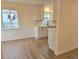 Eat-in kitchen area boasting light-colored cabinetry and modern finishes at 1405 S Utica St, Denver, CO 80219