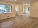 Bright living room featuring hardwood floors, neutral paint, and abundant natural light at 1405 S Utica St, Denver, CO 80219