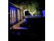 Backyard view of home featuring a hot tub, trees with lights, and backyard access at 4011 S Ivy Ln, Cherry Hills Village, CO 80111