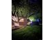 Backyard view featuring a home, hot tub, and lush landscaping at 4011 S Ivy Ln, Cherry Hills Village, CO 80111