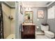 Bathroom featuring tile floors, a modern vanity, and a shower, creating a functional and clean space at 4011 S Ivy Ln, Cherry Hills Village, CO 80111