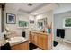 Bright bathroom features double sinks, granite countertops, and a window providing natural light at 4011 S Ivy Ln, Cherry Hills Village, CO 80111
