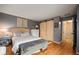 Stylish bedroom featuring a comfortable bed, wood floors, and sliding barn doors for a rustic touch at 4011 S Ivy Ln, Cherry Hills Village, CO 80111