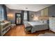 Charming bedroom features hardwood floors, a large mirror, and neutral décor for a relaxing retreat at 4011 S Ivy Ln, Cherry Hills Village, CO 80111