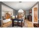 Formal dining room boasts modern lighting, and hardwood floors at 4011 S Ivy Ln, Cherry Hills Village, CO 80111
