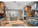 Bright kitchen featuring custom cabinets, a built-in double oven, and a sunlit breakfast nook at 4011 S Ivy Ln, Cherry Hills Village, CO 80111