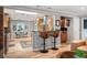 Open-concept kitchen with a breakfast bar and modern appliances for a seamless blend of style and functionality at 4011 S Ivy Ln, Cherry Hills Village, CO 80111