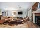 Inviting living room with hardwood floors, brick fireplace, and comfortable seating area at 4011 S Ivy Ln, Cherry Hills Village, CO 80111