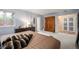 Comfortable main bedroom with plush carpet, natural light, and closet space at 4011 S Ivy Ln, Cherry Hills Village, CO 80111